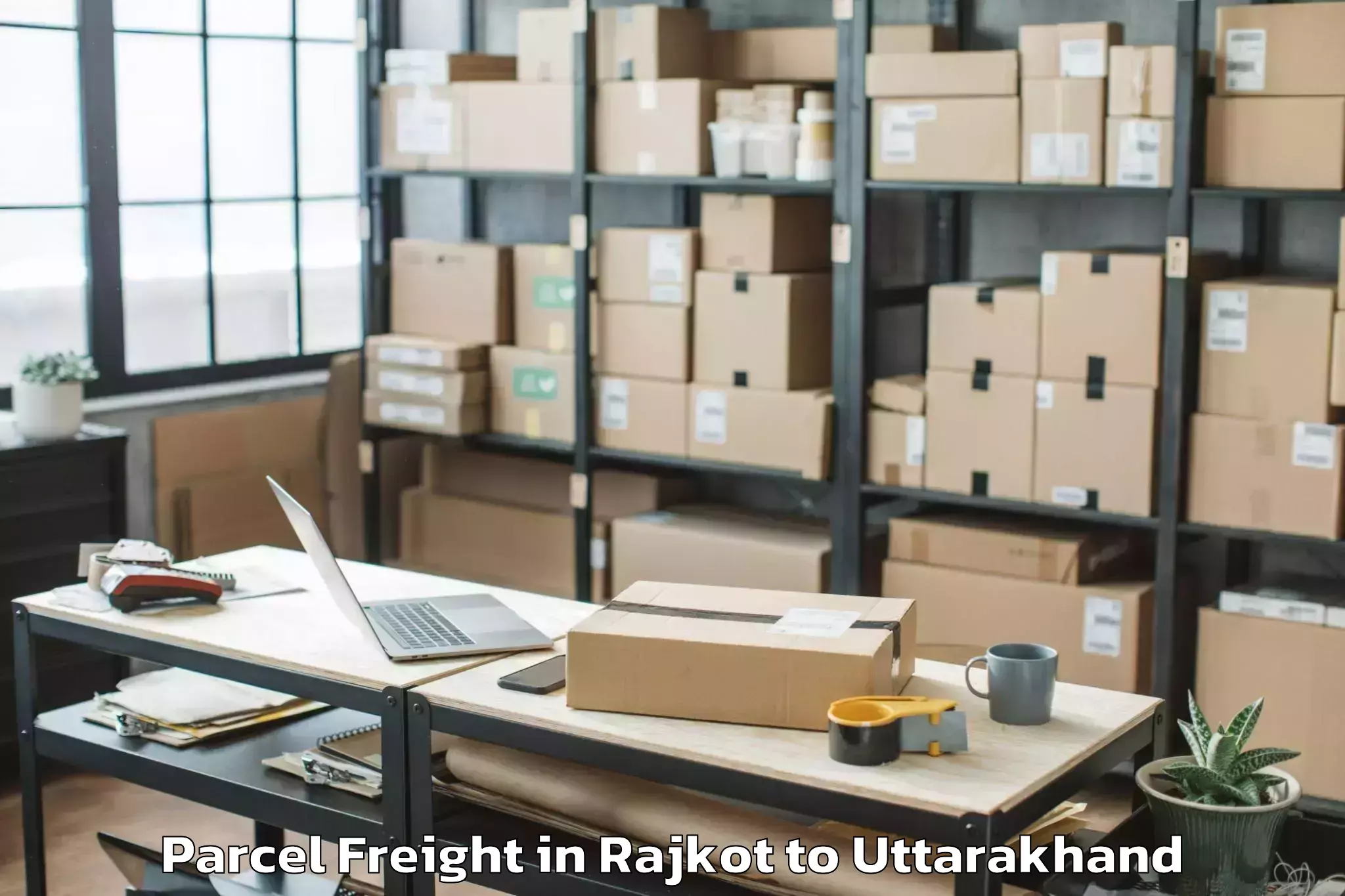 Book Rajkot to Graphic Era Hill University Cl Parcel Freight Online